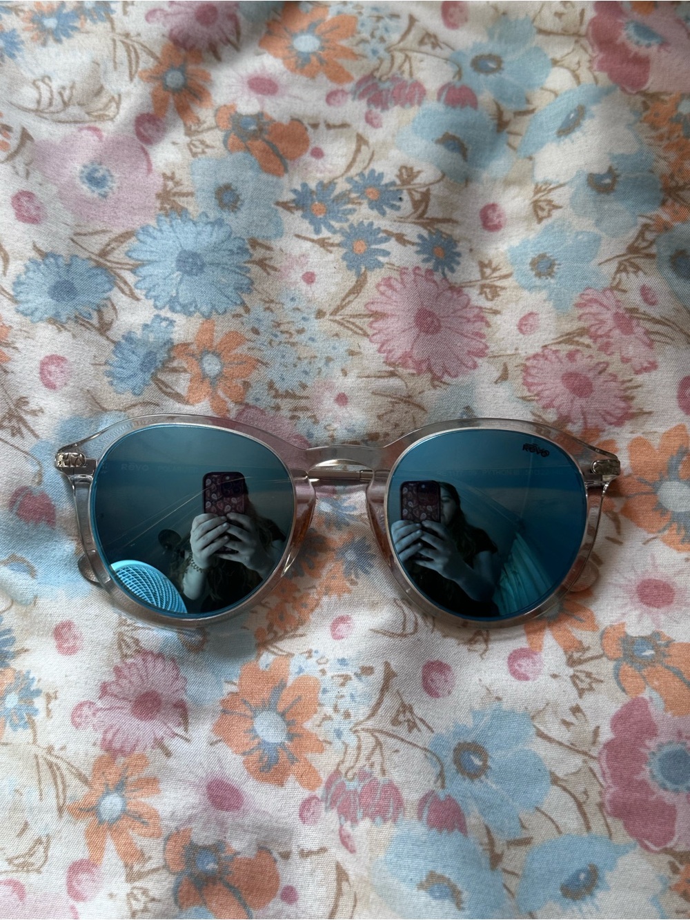 Revo Clear Frame Sunglasses with Blue Mirrored Lenses